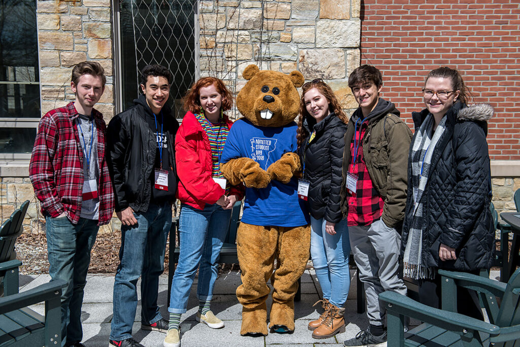 Students pose with Chauncey the beaver at Admitted Student Day.