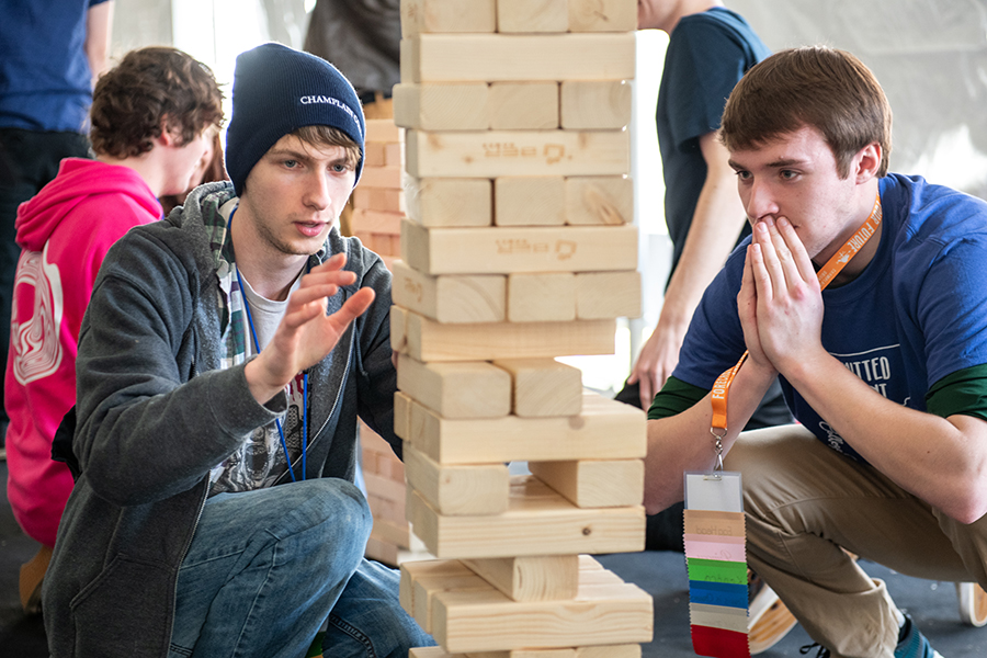 Two students play giant Jenga at Admitted Student Day.